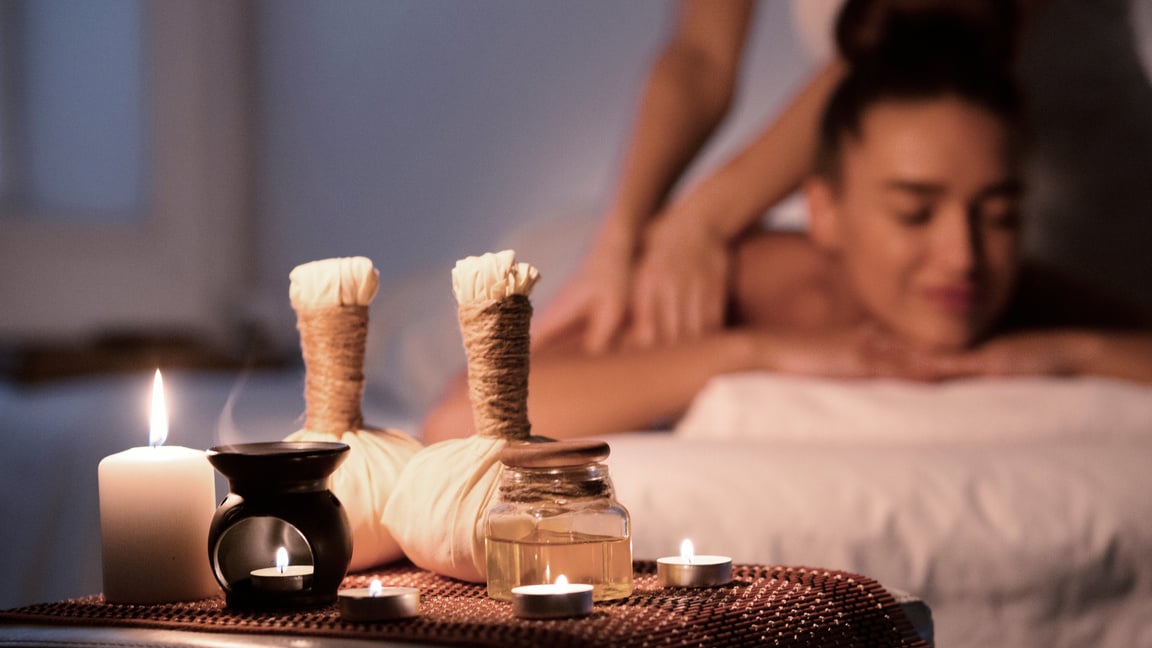 Thai massage. Woman receiving back massage in spa